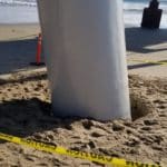 Photo of concrete structural and erosion support installed on the base of a steel pier pile