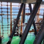 Installation of Denso® pile wrap on steel pier piling